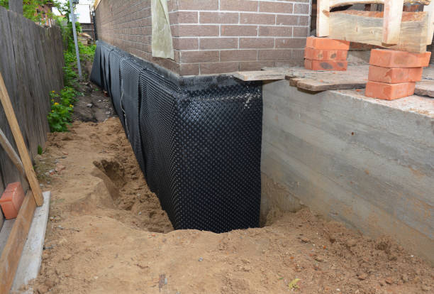 SJ Waterproofing Pros technician performing targeted Waterproofing assessment in Merchantville, NJ